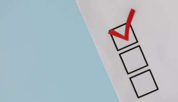 red check mark over black box