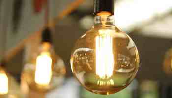 lighted light bulb in selective focus photography